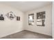 Bedroom with carpet flooring, two windows and wall art at 1750 W Mohawk Ln, Phoenix, AZ 85027