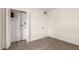 Bedroom features bi-fold closet doors and carpet flooring at 1750 W Mohawk Ln, Phoenix, AZ 85027
