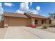Inviting single-story home with a 2-car garage, showcasing a neat front yard for low-maintenance desert living at 1750 W Mohawk Ln, Phoenix, AZ 85027