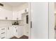 Modern kitchen with white cabinets, stainless steel appliances, and sleek design at 1750 W Mohawk Ln, Phoenix, AZ 85027