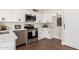 Bright kitchen featuring white cabinets and stainless appliances at 1750 W Mohawk Ln, Phoenix, AZ 85027