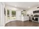 Bright kitchen features white cabinets, stainless appliances, and wood-look tile flooring at 1750 W Mohawk Ln, Phoenix, AZ 85027