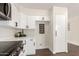 Bright kitchen featuring white cabinets and modern hardware at 1750 W Mohawk Ln, Phoenix, AZ 85027
