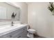 Powder room featuring gray vanity with a light countertop, tile floor and modern mirror at 1761 E 38Th Ave, Apache Junction, AZ 85119