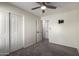 Bedroom boasts ample closet space and an adjacent doorway, with an installed wall mount at 1761 E 38Th Ave, Apache Junction, AZ 85119