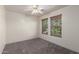Cozy bedroom with neutral walls, carpet flooring, and dual windows with wood-look blinds at 1761 E 38Th Ave, Apache Junction, AZ 85119
