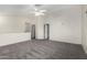 Spacious bonus room with vaulted ceilings, neutral carpet and multiple doorways at 1761 E 38Th Ave, Apache Junction, AZ 85119
