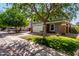 Two-story home with shade trees, stone accents, two-car garage, and lush green lawn at 1761 E 38Th Ave, Apache Junction, AZ 85119