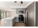 Kitchen with modern appliances, gray cabinets, white countertops, and open to the living space at 1761 E 38Th Ave, Apache Junction, AZ 85119