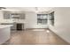 Kitchen with modern gray cabinets, stainless steel appliances, and a view of the living area at 1761 E 38Th Ave, Apache Junction, AZ 85119