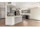 Bright kitchen with white countertops, gray cabinets, stainless steel appliances, and breakfast bar at 1761 E 38Th Ave, Apache Junction, AZ 85119