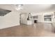 Open-concept living space with tile floors, ceiling fans, and a view of the kitchen area at 1761 E 38Th Ave, Apache Junction, AZ 85119