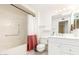 Bathroom featuring a shower-tub combo with vanity at 17627 N 104Th Ave, Sun City, AZ 85373
