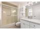 Bathroom featuring a shower with glass doors and vanity at 17627 N 104Th Ave, Sun City, AZ 85373