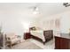 Bedroom features desk, chair, nightstand, lamp and a ceiling fan at 17627 N 104Th Ave, Sun City, AZ 85373