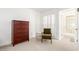 Bedroom showcases shuttered windows, a sitting area and closet at 17627 N 104Th Ave, Sun City, AZ 85373