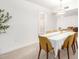 Elegant dining area featuring modern lighting and seating for six at 17627 N 104Th Ave, Sun City, AZ 85373