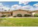 Inviting single-story home with manicured lawn and desert landscaping under a beautiful blue sky at 17627 N 104Th Ave, Sun City, AZ 85373