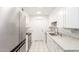 Bright kitchen with stainless steel appliances, white cabinetry, and granite countertops at 17627 N 104Th Ave, Sun City, AZ 85373