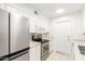 Stylish kitchen features stainless steel appliances and white cabinets at 17627 N 104Th Ave, Sun City, AZ 85373