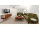 Cozy living room boasts comfortable seating, a media console, and bright lighting at 17627 N 104Th Ave, Sun City, AZ 85373