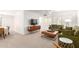 Inviting living area with comfortable seating, a modern media console, and lots of natural light at 17627 N 104Th Ave, Sun City, AZ 85373