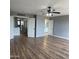 Spacious room featuring wood floors and an ensuite bathroom at 1876 N Parkside Ln, Casa Grande, AZ 85122