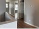 Hallway with wood floors and access to multiple rooms at 1876 N Parkside Ln, Casa Grande, AZ 85122
