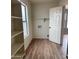 Bright laundry room featuring a window, shelving, and hookups at 1876 N Parkside Ln, Casa Grande, AZ 85122