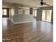 Open-concept room with sliding glass doors and modern ceiling fan at 1876 N Parkside Ln, Casa Grande, AZ 85122