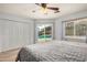 Bedroom boasts wood-look floors and a sliding glass door with backyard and pool views at 19645 N 3Rd Ave, Phoenix, AZ 85027