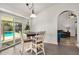 Dining area featuring a four-chair table and sliding door that leads to the backyard at 19645 N 3Rd Ave, Phoenix, AZ 85027