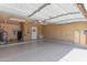 This clean garage with epoxy flooring includes a utility sink, water heater, and additional storage space at 19645 N 3Rd Ave, Phoenix, AZ 85027