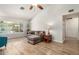 Open-concept living room featuring laminate floors, a large window, and neutral wall colors at 19645 N 3Rd Ave, Phoenix, AZ 85027
