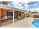 Spacious covered patio with cozy seating area, perfect for outdoor entertaining near the pool at 19645 N 3Rd Ave, Phoenix, AZ 85027