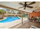 Inviting covered patio overlooking a private backyard pool with fun inflatables and ample seating at 19645 N 3Rd Ave, Phoenix, AZ 85027