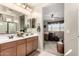Bright bathroom boasts dual sinks, an expansive mirror, and a neutral color palette at 21056 W Granada Rd, Buckeye, AZ 85396