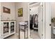 Bathroom with walk-in closet, towel rack and white cabinets at 21056 W Granada Rd, Buckeye, AZ 85396