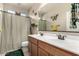 Bright bathroom with double sinks and butterfly decor at 21056 W Granada Rd, Buckeye, AZ 85396