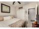 Bright bedroom features a window, bed and closet at 21056 W Granada Rd, Buckeye, AZ 85396