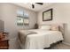 Bright bedroom featuring a window, bed and TV at 21056 W Granada Rd, Buckeye, AZ 85396