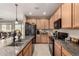 Well-appointed kitchen features granite counters, stainless appliances, and ample cabinet space at 21056 W Granada Rd, Buckeye, AZ 85396