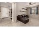Cozy living room with carpet, ceiling fan, and a comfortable couch at 21056 W Granada Rd, Buckeye, AZ 85396