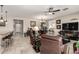 Spacious living room with tile floors, ceiling fans, and a view of the kitchen at 21056 W Granada Rd, Buckeye, AZ 85396