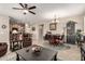 Open-concept living space featuring tile floors, recessed lighting, and a view of the kitchen at 21056 W Granada Rd, Buckeye, AZ 85396