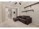 Cozy living room with carpet, ceiling fan, and a comfortable couch at 21056 W Granada Rd, Buckeye, AZ 85396