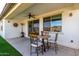 Covered patio with ceiling fan and cozy seating at 21056 W Granada Rd, Buckeye, AZ 85396