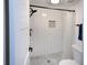 Modern bathroom includes subway tile shower, black hardware, and mosaic floor at 2146 W Isabella Ave # 154, Mesa, AZ 85202