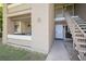 Inviting condo exterior with well-maintained landscaping and convenient stairway access at 2146 W Isabella Ave # 154, Mesa, AZ 85202