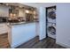 Well-lit kitchen with stainless steel appliances and compact, stacked washer and dryer at 2146 W Isabella Ave # 154, Mesa, AZ 85202